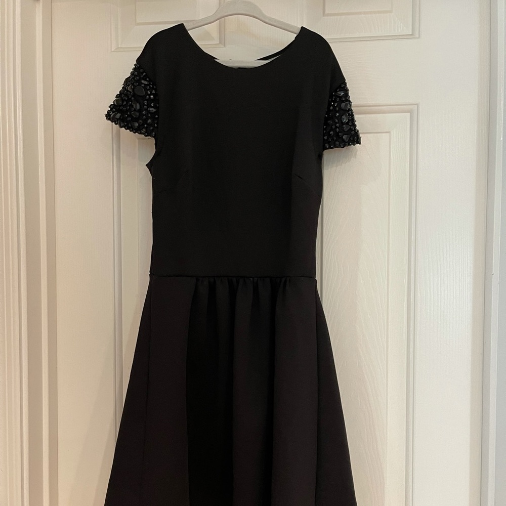 Girls dress with black rhinestone on shoulder
